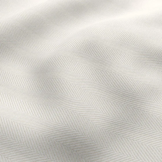 Photo of the fabric Trailblazer Ivory swatch by James Dunlop FibreGuard. Use for Curtains, Upholstery, Accessory, Top of Bed. Style of Texture, Traditional