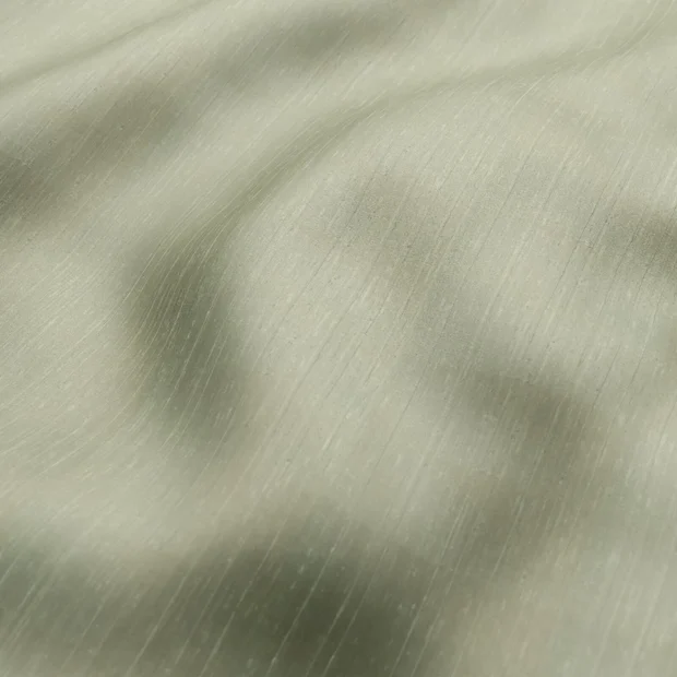 Photo of the fabric Luxe Sage swatch by James Dunlop Essentials. Use for Curtains, Accessory, Top of Bed. Style of Plain, Texture