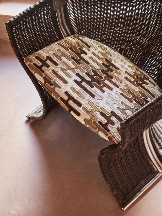 Retro-inspired crewel embroidery upholstery on unique chair