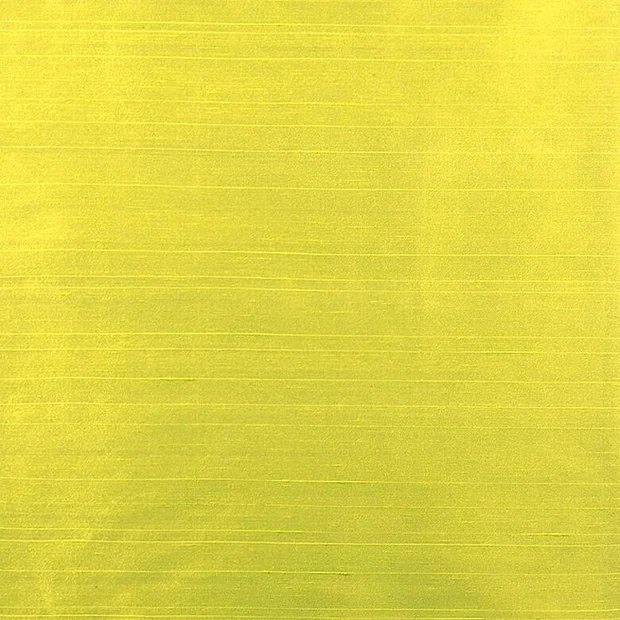 Photo of the fabric Luxe Chartreuse swatch by James Dunlop Essentials. Use for Curtains, Accessory, Top of Bed. Style of Plain, Texture