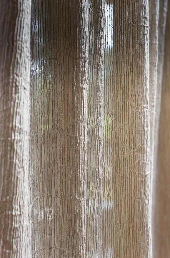 Photo of the fabric Turbulent Storm in situ by James Dunlop. Use for Sheer Curtains. Style of Plain, Sheer