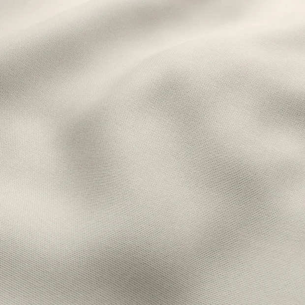 Photo of the fabric Sit Out Beige swatch by James Dunlop FibreGuard. Use for Upholstery, Accessory. Style of Plain, Taffeta