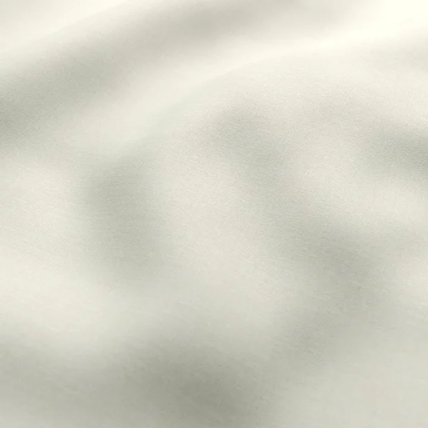 Photo of the fabric Kidglove Cream swatch by Zepel FibreGuard. Use for Curtains, Upholstery, Accessory, Top of Bed. Style of Plain, Taffeta