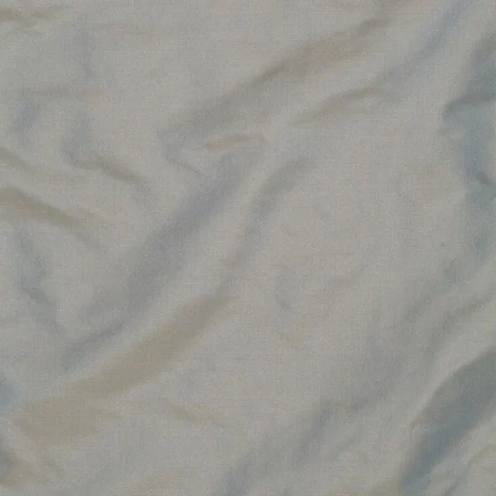Photo of the fabric Taffy Abyss swatch by James Dunlop Essentials. Use for Curtains, Upholstery Light Duty, Accessory, Top of Bed. Style of Plain, Taffeta