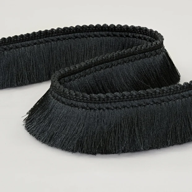Photo of the fabric Brush Fringe T120 06 swatch by Romo. Use for Trim