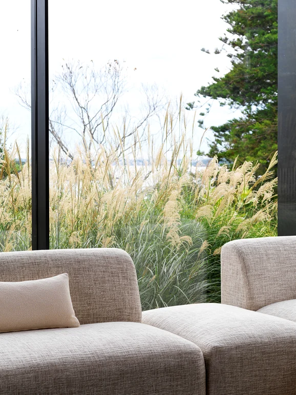 Photo of the fabric Earthwild Cream in situ by James Dunlop FibreGuard. Use for Curtains, Upholstery, Accessory, Top of Bed. Style of Plain, Texture