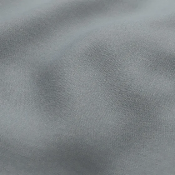 Photo of the fabric Infinite Powder Blue swatch by Mokum. Use for Curtains, Upholstery, Accessory, Top of Bed. Style of Plain, Texture
