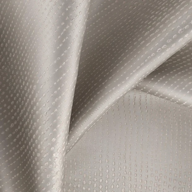 Photo of the fabric Glint Pelican swatch by Zepel. Use for Curtains, Accessory, Top of Bed. Style of Geometric, Jacquard