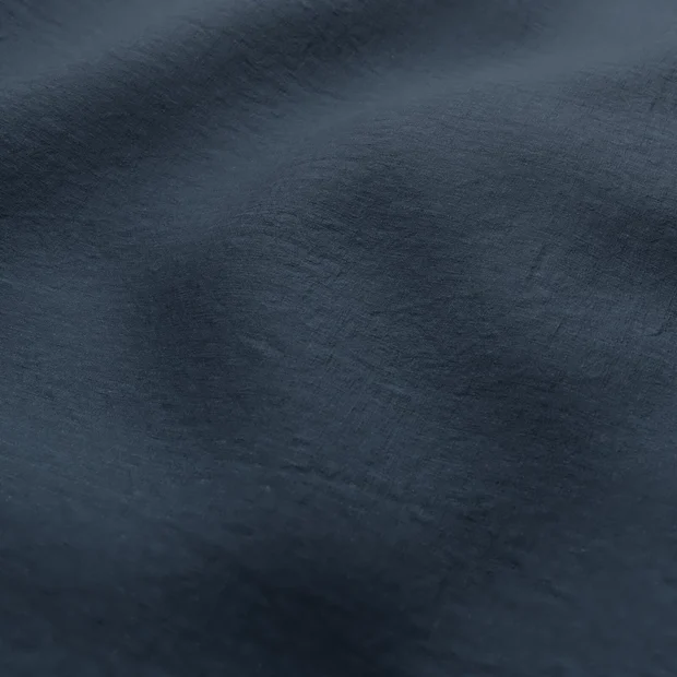 Photo of the fabric Satori Stonewash Ink swatch by Mokum. Use for Curtains, Upholstery Light Duty, Accessory, Top of Bed. Style of Plain, Texture