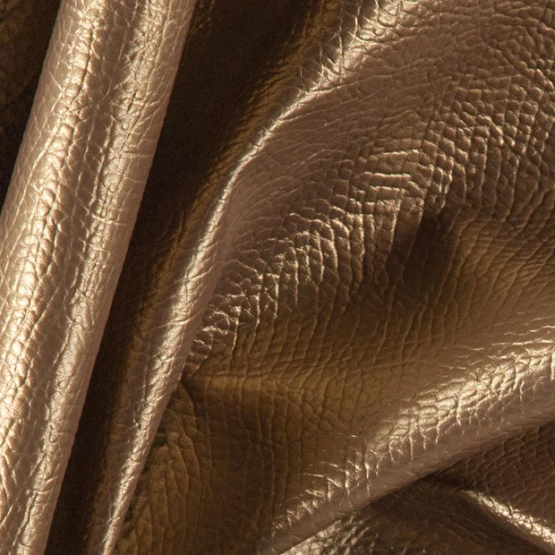 Photo of the fabric Nashi Bronze swatch by Zepel. Use for Upholstery, Accessory, Top of Bed. Style of Leather And Vinyl, Plain