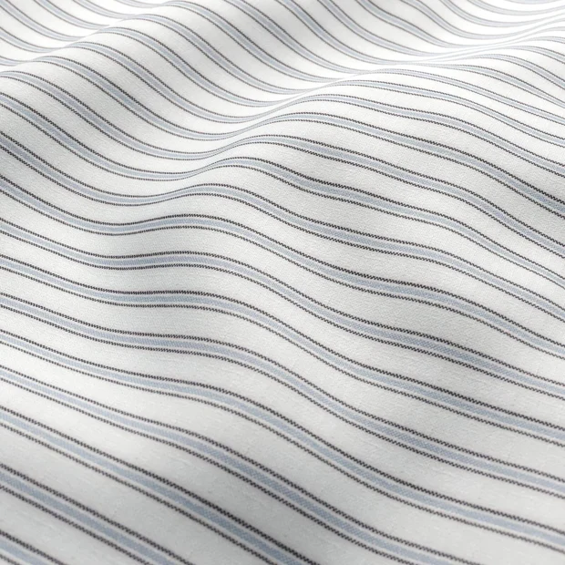 Photo of the fabric Chambray Ticking Sky Blue swatch by Zepel. Use for Curtains, Upholstery, Accessory. Style of Stripe, Taffeta