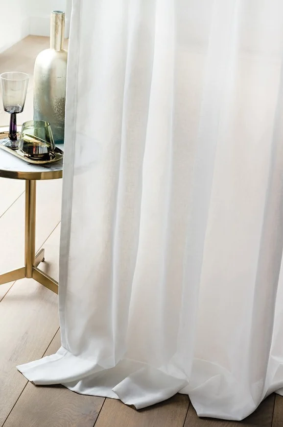 Photo of the fabric Purete 4252 4252 0126 in situ by Casamance. Use for Sheer Curtains. Style of Plain, Sheer