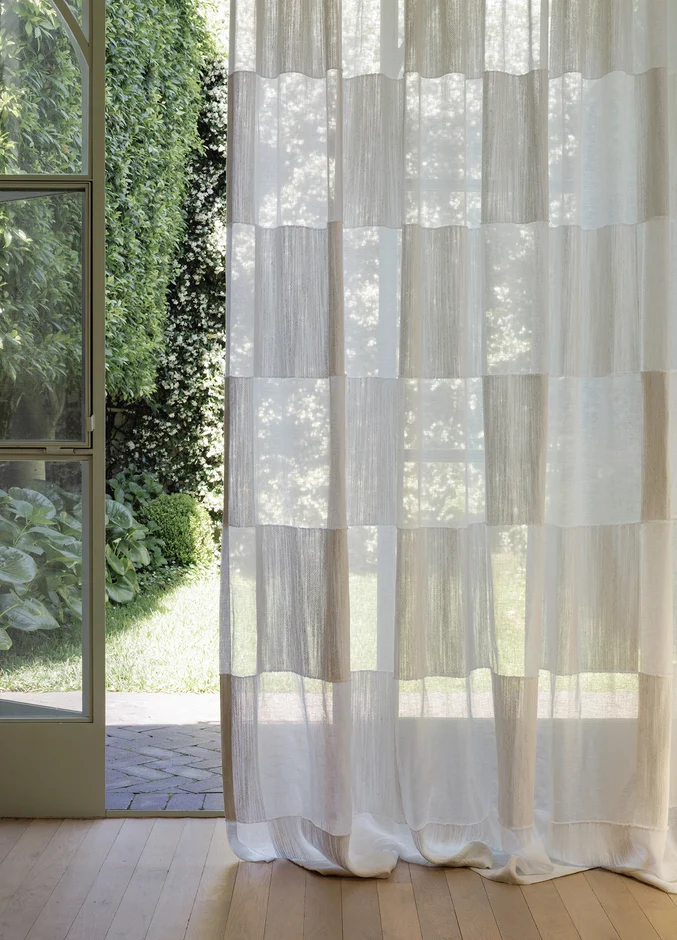 Geometric sheer curtain fabric in serene setting