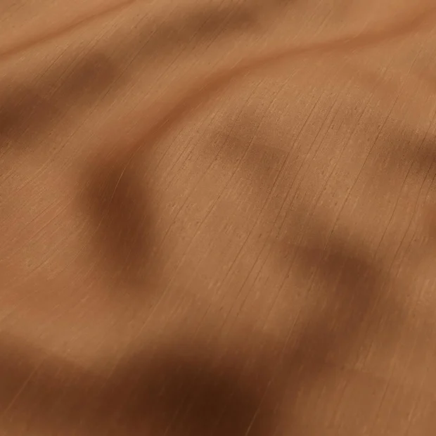 Photo of the fabric Silky Nutmeg swatch by Zepel. Use for Curtains, Accessory, Top of Bed. Style of Plain, Texture
