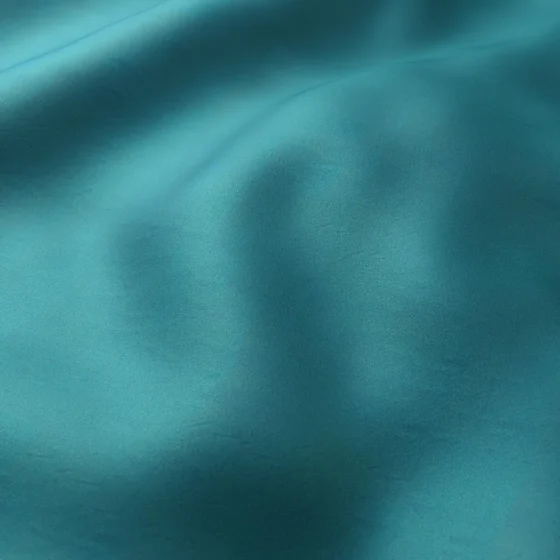 Photo of the fabric Catwalk Lagoon swatch by Zepel. Use for Curtains, Upholstery Light Duty, Accessory, Top of Bed. Style of Plain, Taffeta