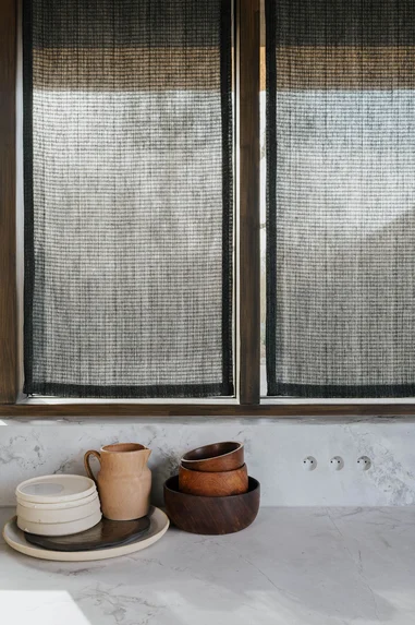 Rustic interior setting with fabric blinds
