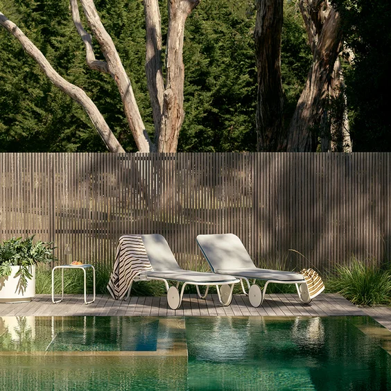 Sun loungers in poolside setting