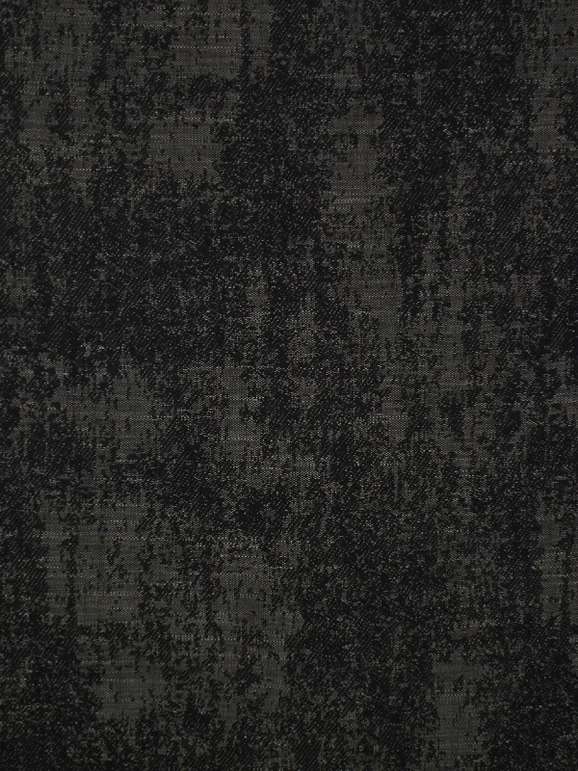 Photo of the fabric Veranda Basalt in situ by Mokum. Use for Upholstery, Accessory. Style of Plain, Texture