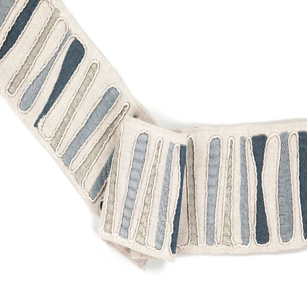 Photo of the fabric Abstract Border T106 05 swatch by Villa Nova. Use for Trim